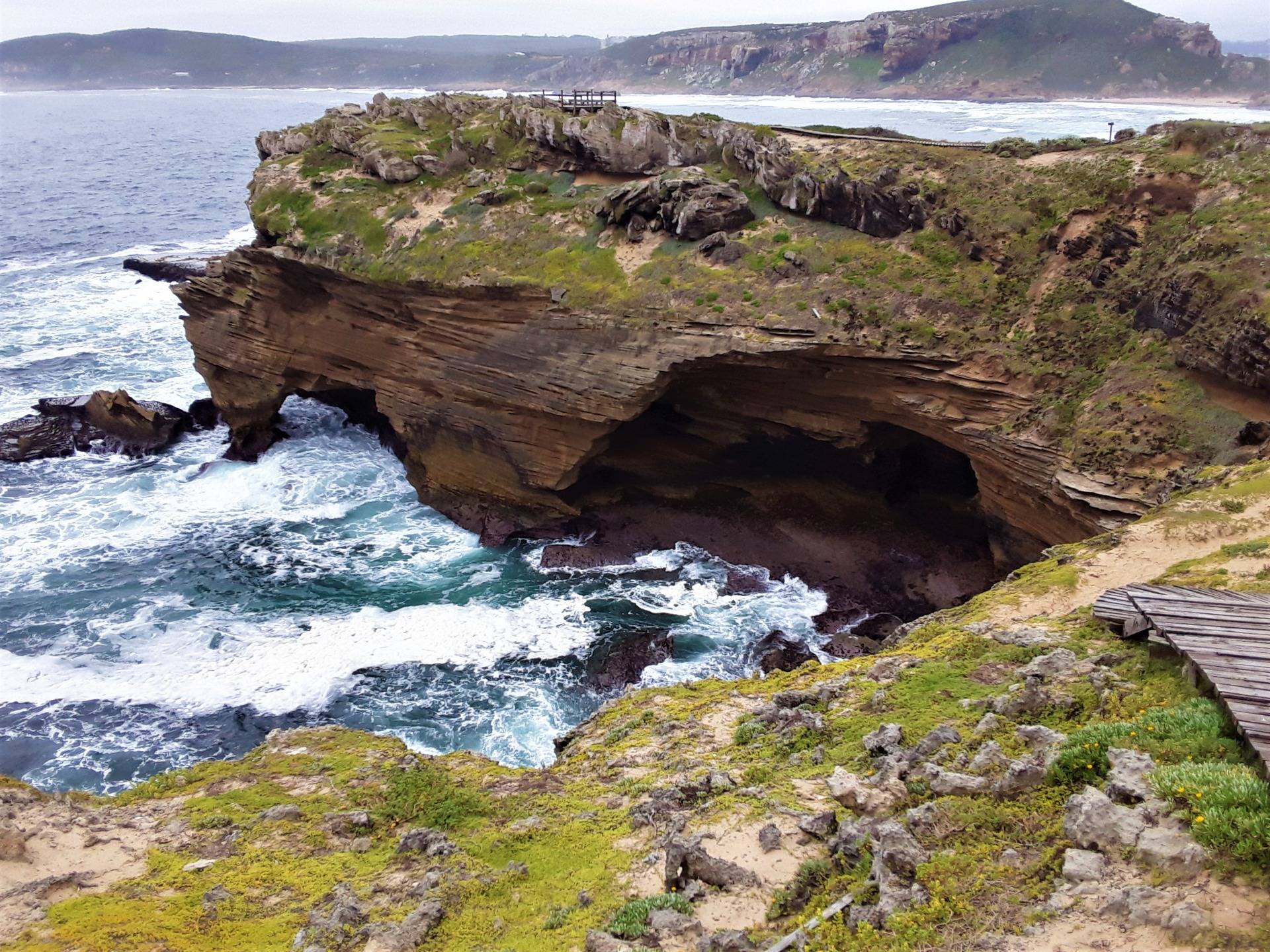 Epic sandstone rock caves weathered by wind and waves