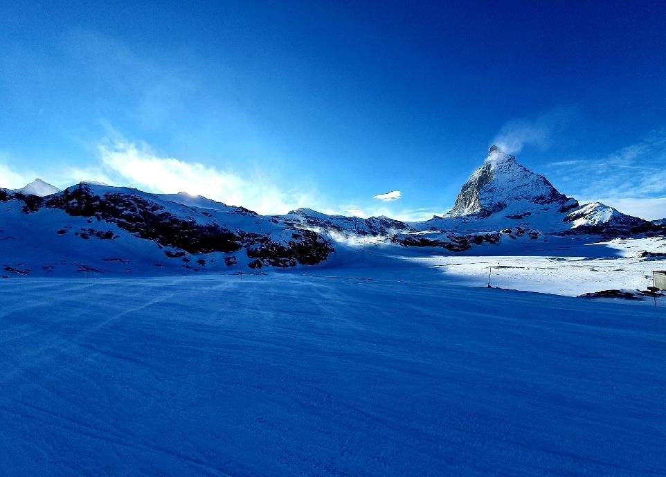 See the wind blowing up the snow over the ridges