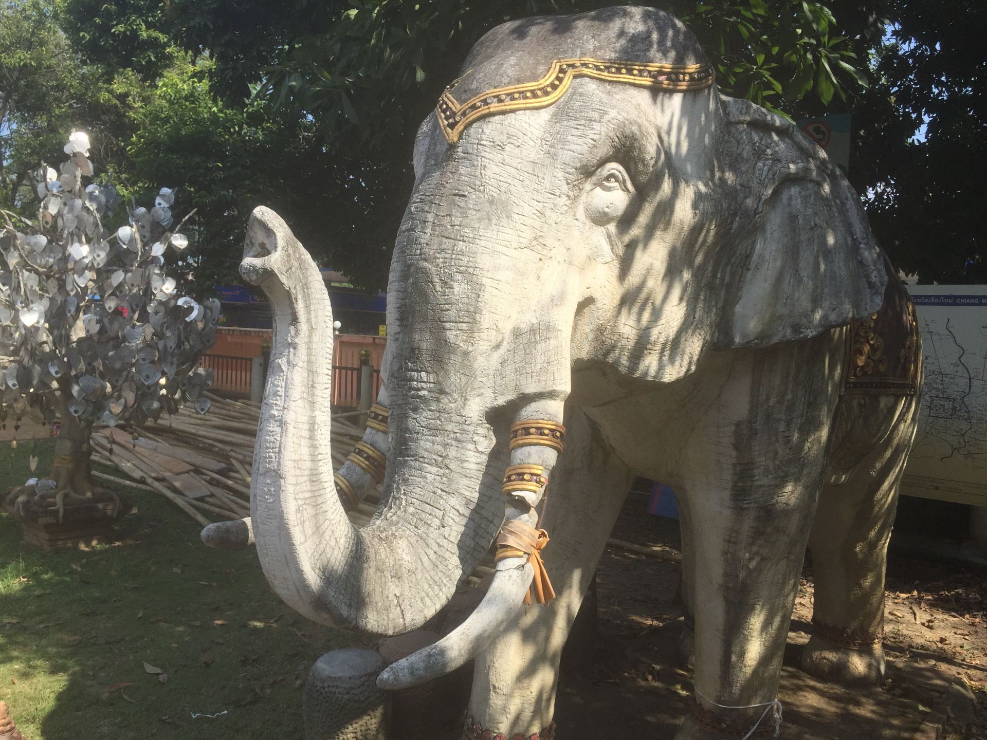 Two stone elephants line the pathway to the temple