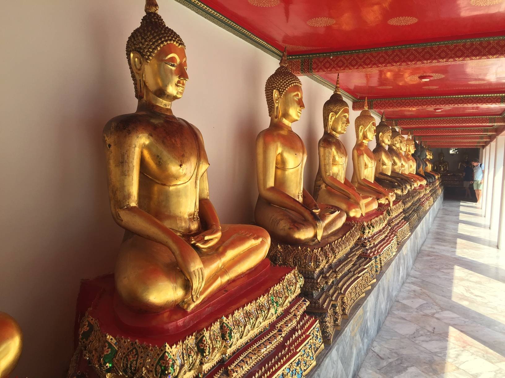 Row of seated Buddha statues