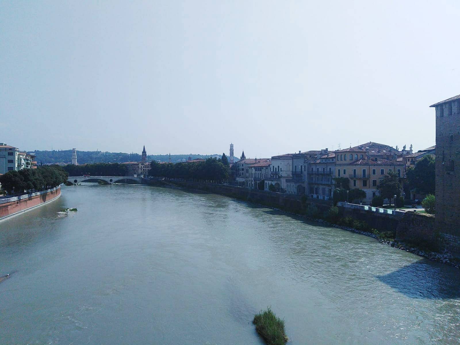 A beautiful view over numerous houses of Verona and the river Adige. Do you see the Torre dei Lomberti?