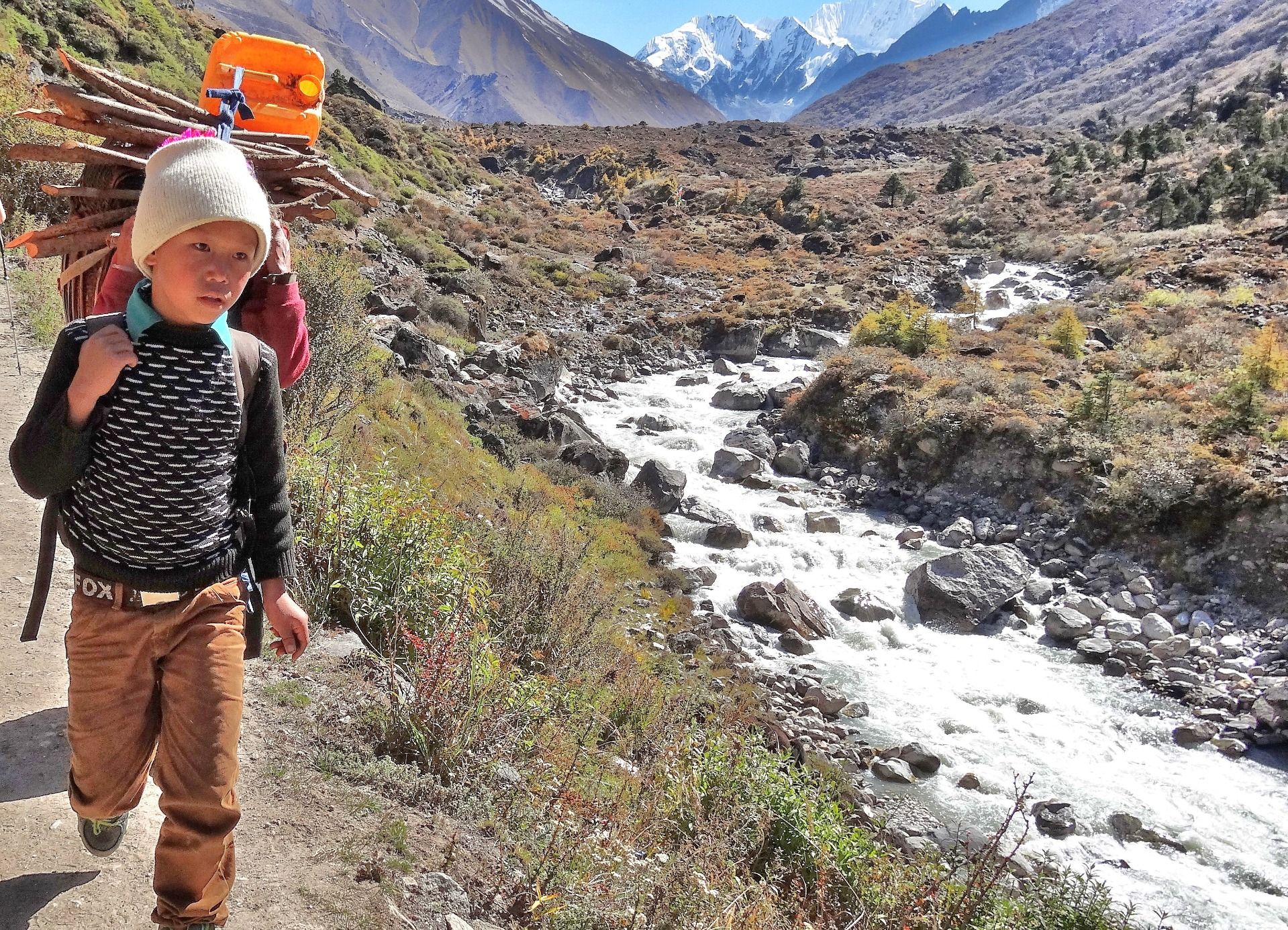 This young boy is a porter for lightweight goods.