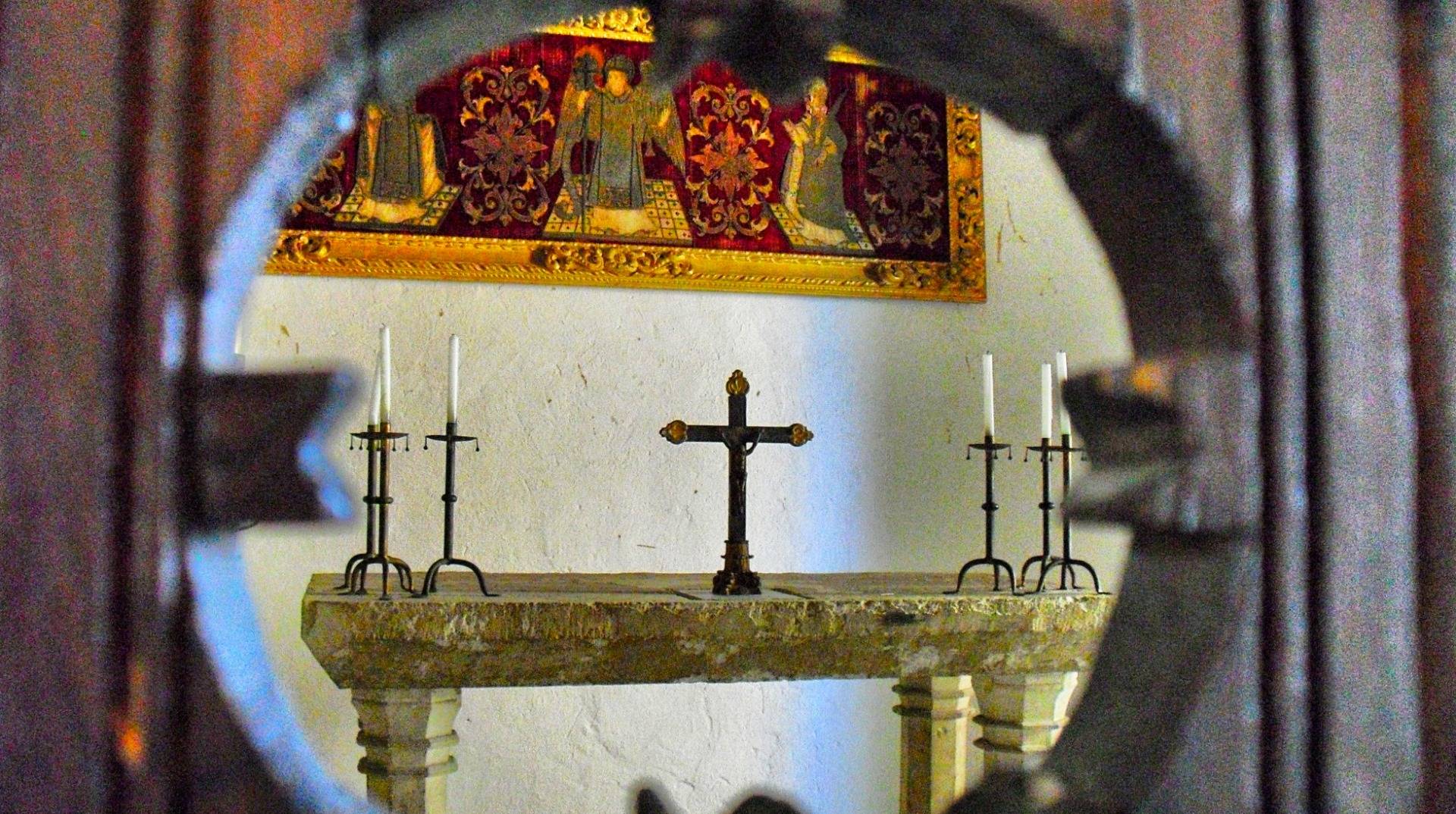A small cross in an old church