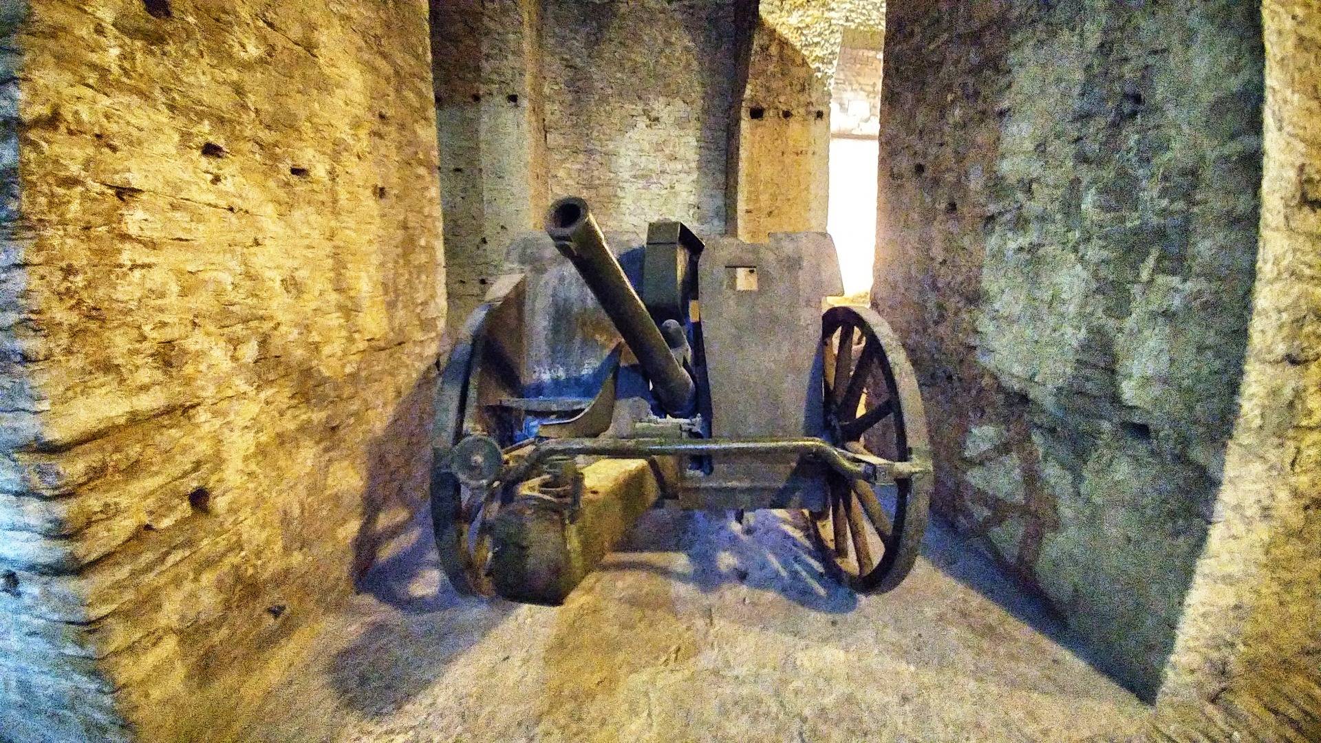 A cannon shown in the underground of the castle