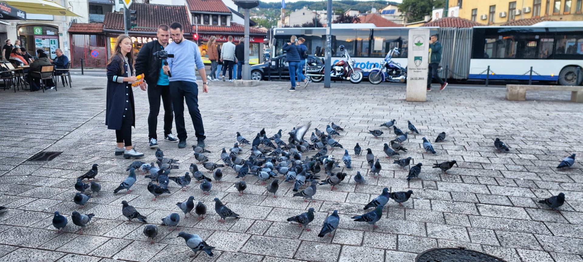 Feeding pigeons at the Baščaršija bazaar district.