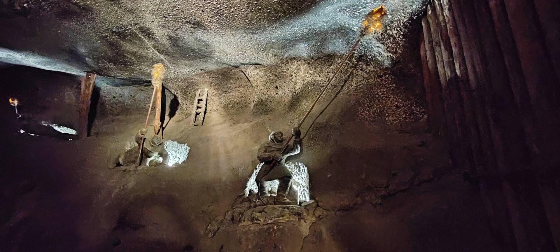 This miner is burning gases out of the cave