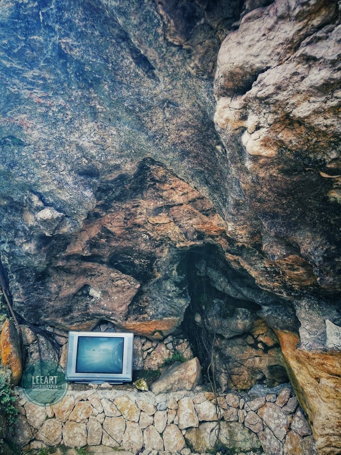 I’m curious as to why an old TV was placed there. When you look at the rocks, there are so many faces and figures that can be formed. The more you look, the more you’ll see. Just let your eyes and your mind relax. Maybe the TV is connected with those.
