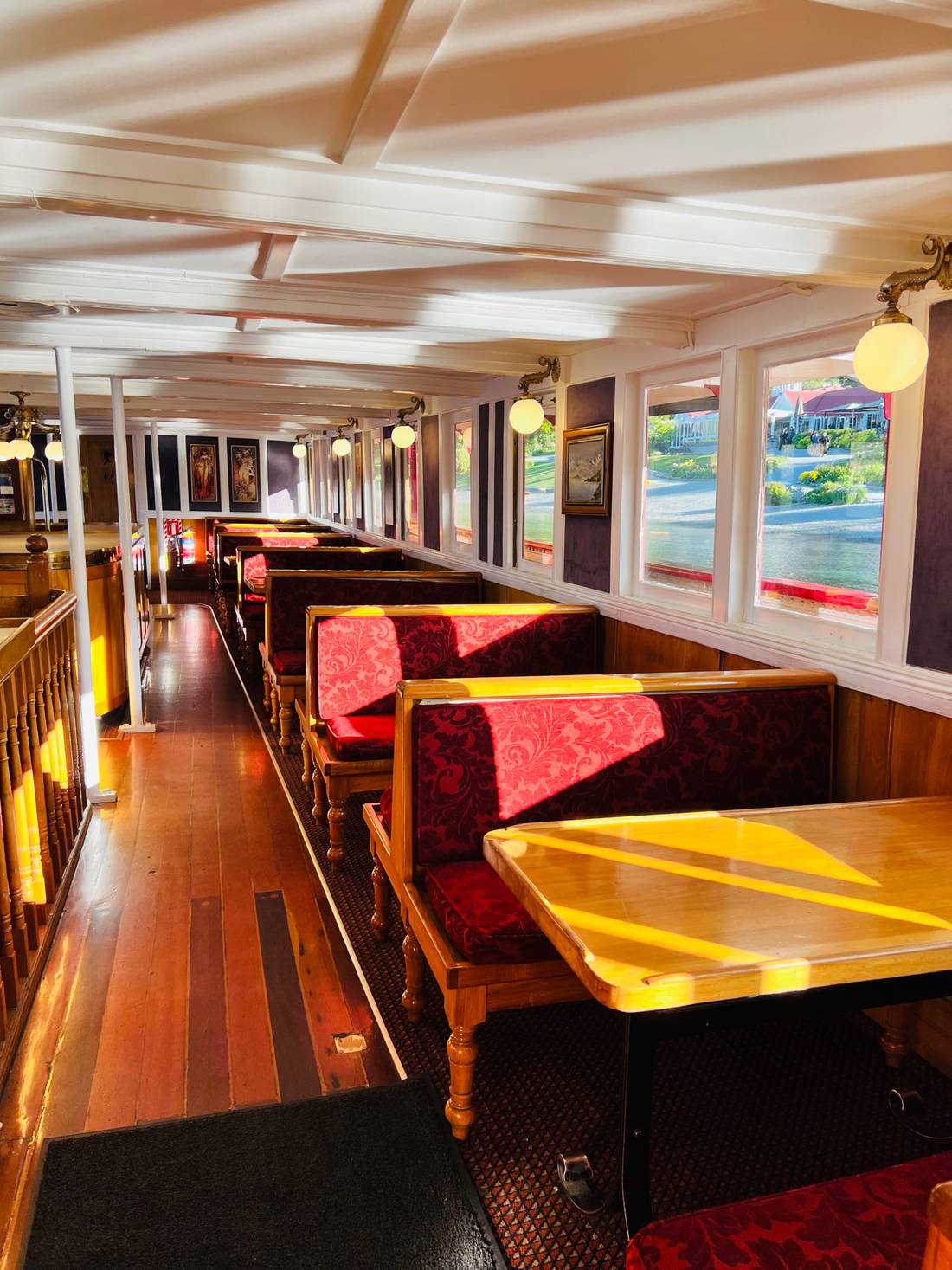 Inside the lower level passengers compartment. The boat has been refurbished on the interior, decked out with some beautiful red velvet, and treated timbers.