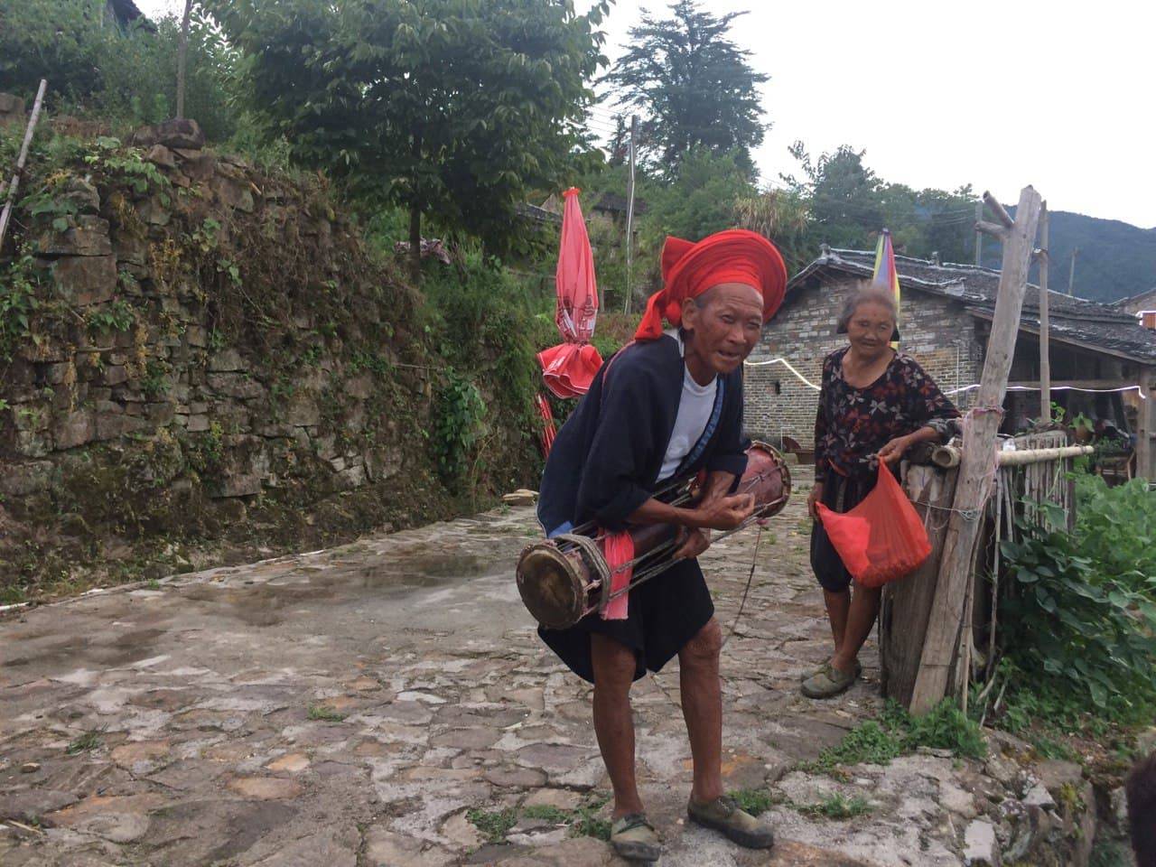 When we were leaving the village, his wife came out of the house and said bye to us. What a cute couple of Yao! Thank you for the dance performance!