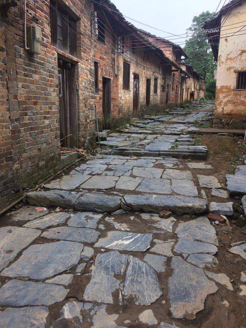 This stone pedestrian road looks pretty old. There were no paved roads in the village. It is like the Old Town of Stockholm (Gamla Stan) in Sweden.
