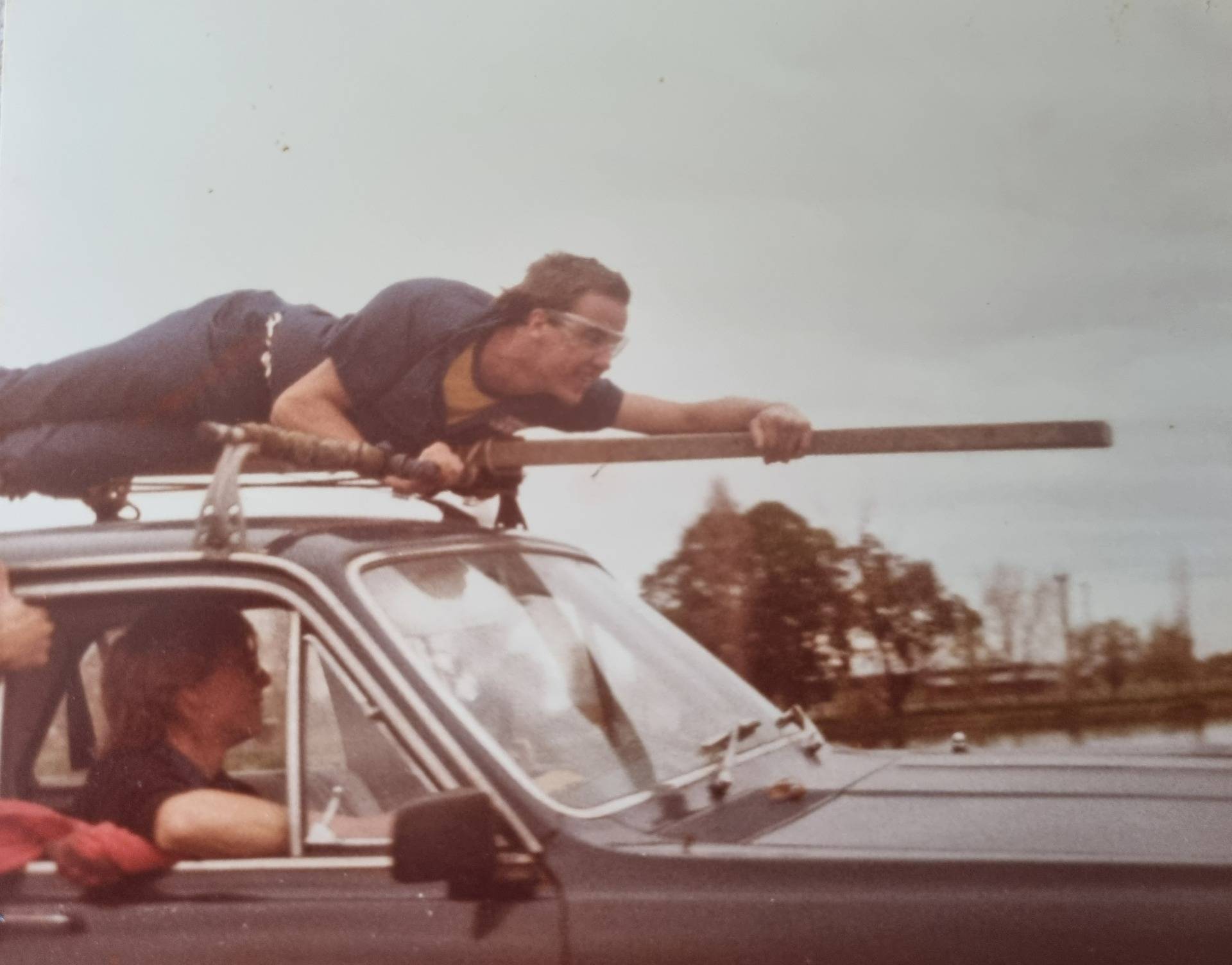 A bit of an old school apprentice initiation’s. A lap around the lake on top of the tradesman’s car, to get used to riding on top of lift cars. Even had the safety glasses back in the old days. LOL