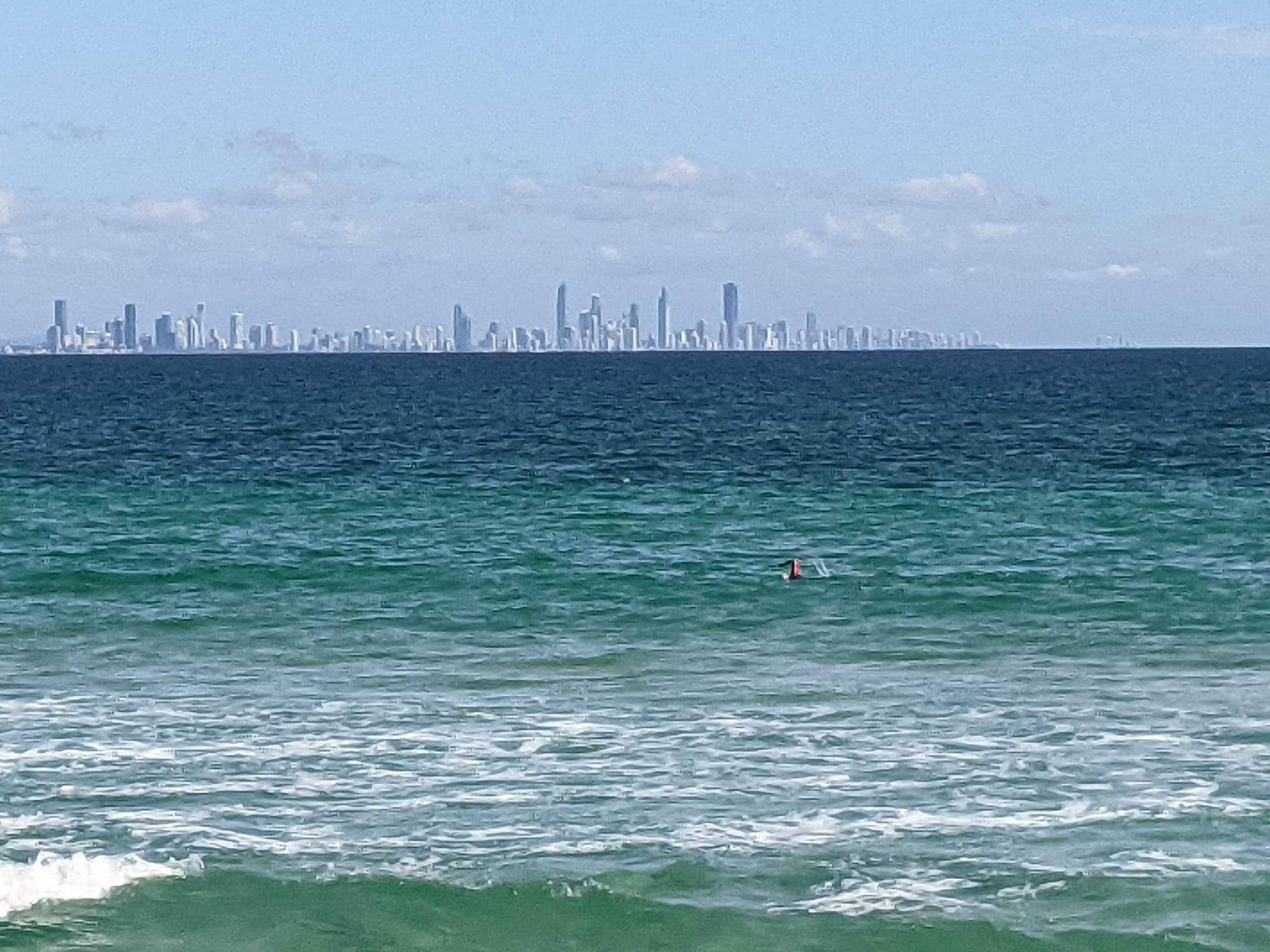 After our walk, I did a swim from Rainbow Bay to the start of Coolangatta Beach @consciouscat was able to get a great action photo with the iconic Surfers paradise skyline.