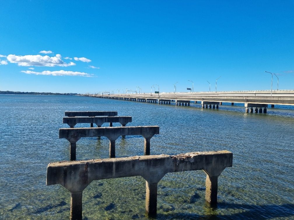 What is left of the first bridge looking over Hays Inlet and Bramble Bay with the newer ’Ted Smout Memorial Bridge’ bridges to the right. Ted was Queensland last World War one Veteran who lived in the area.