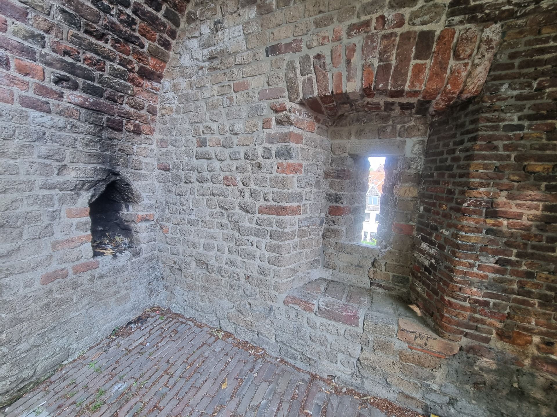 I can just imagine somebody trying to stay warm all night while on some sort of watch duty. Interesting to see the different bricks used in different renovations.