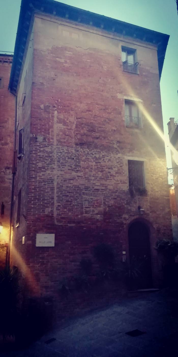 The house with the typical rock of Siena with the typical colors of Tuscany.