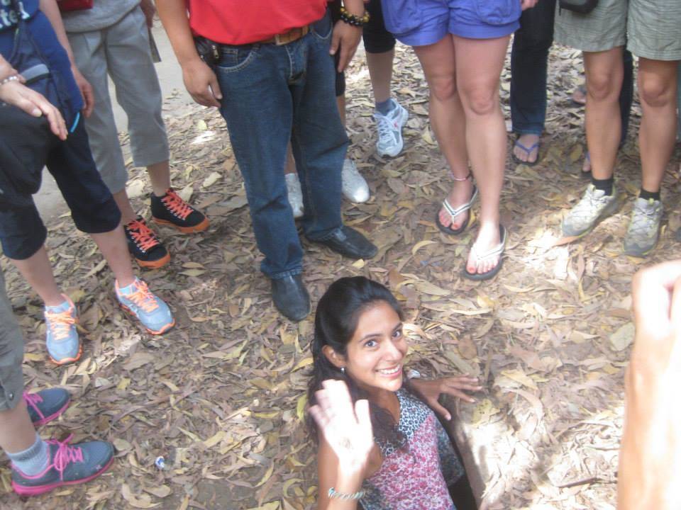 A girl disappearing down one of the Cu Chi Tunnels!