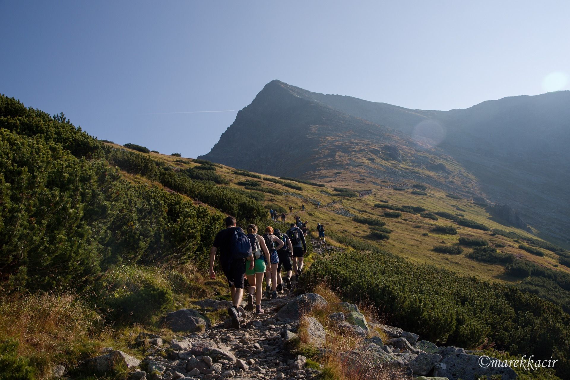 tourists and destination hiking in the background