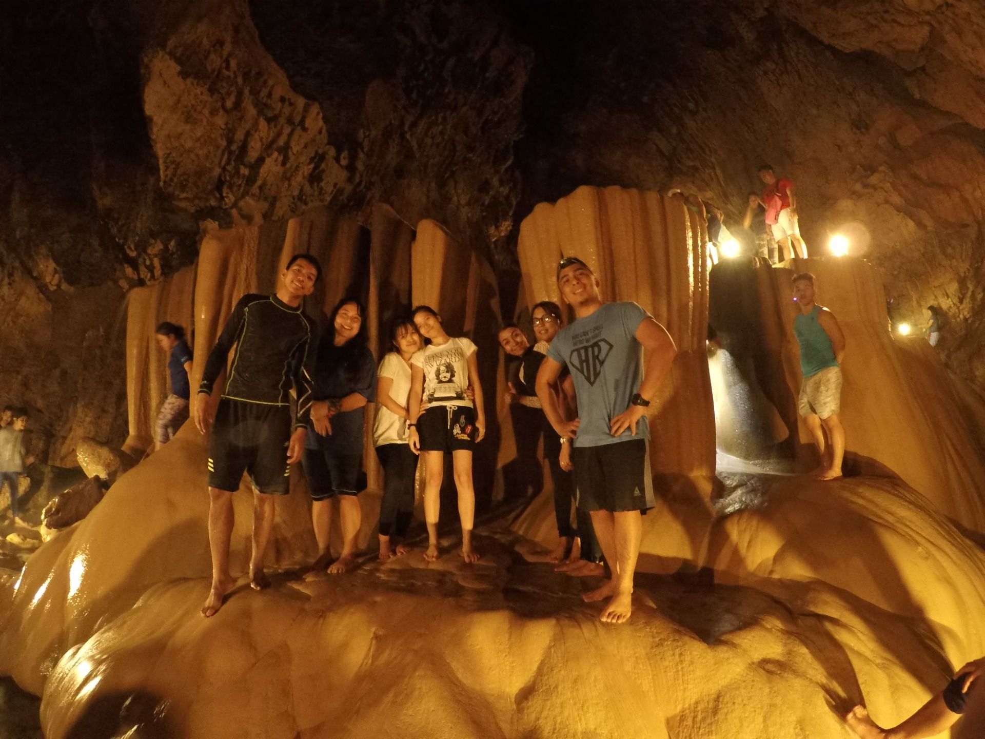 Check out the tall rock behind us. We had to climbed that down one person at a time. 