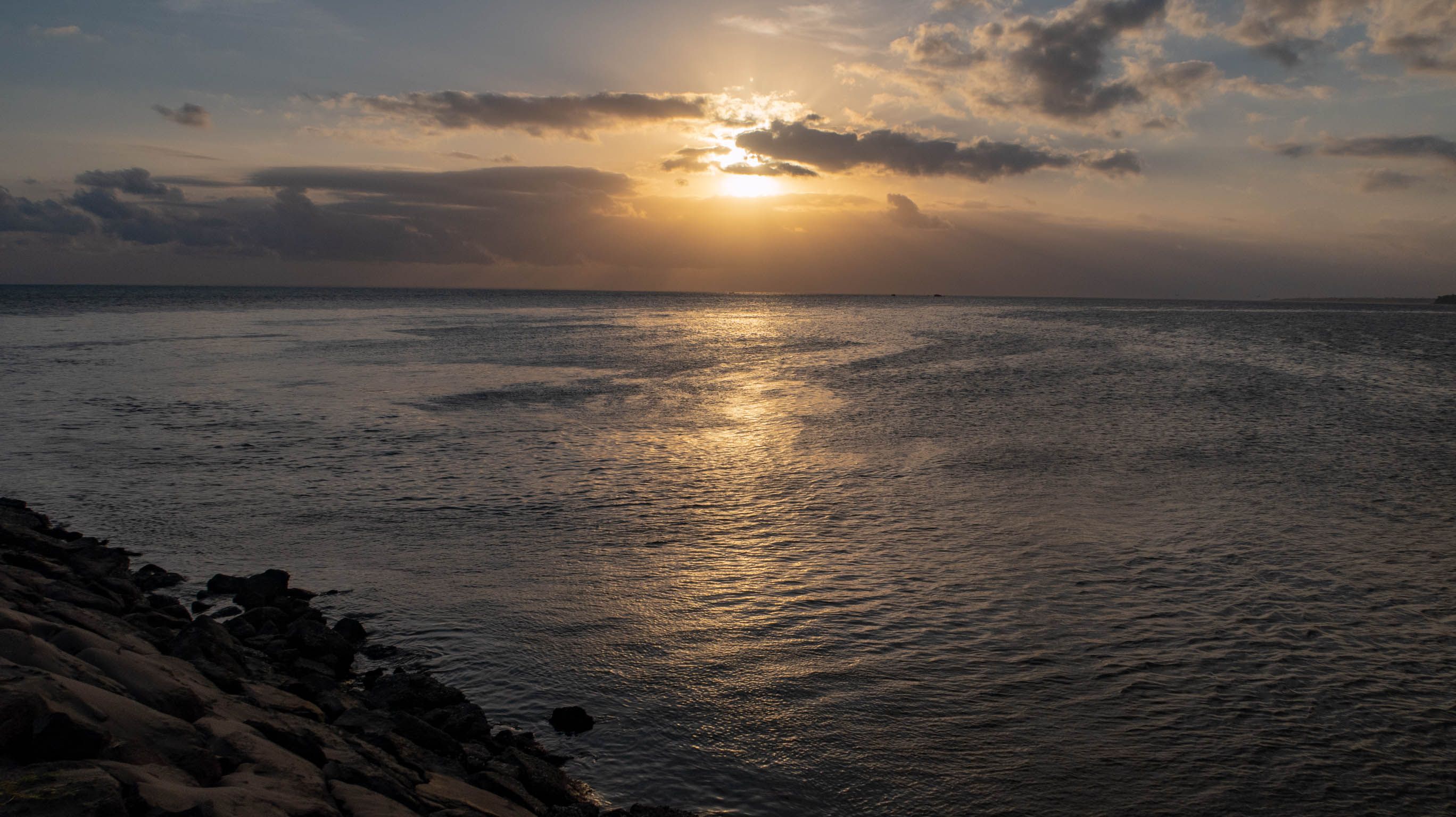 The view of the sun in the western sky as it got closer to the horizon.