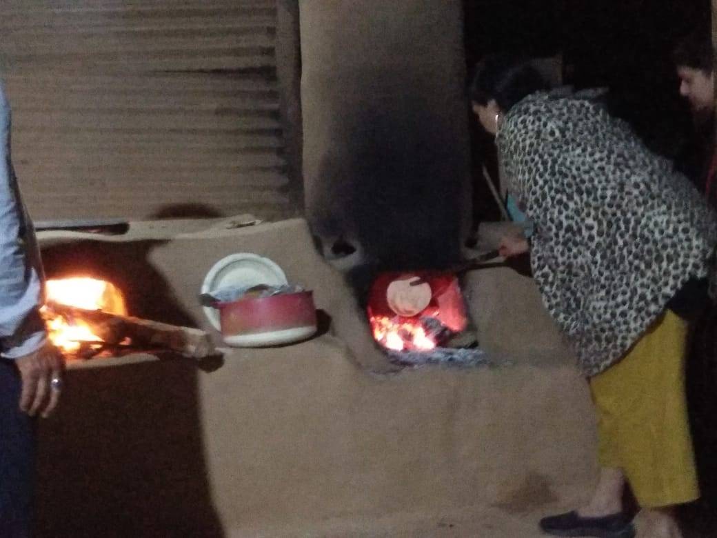Cooking in a mud kiln. Gives a nice earthy flavor to food
