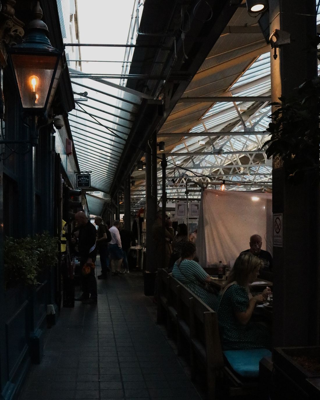 People enjoying a pub stop inside the market