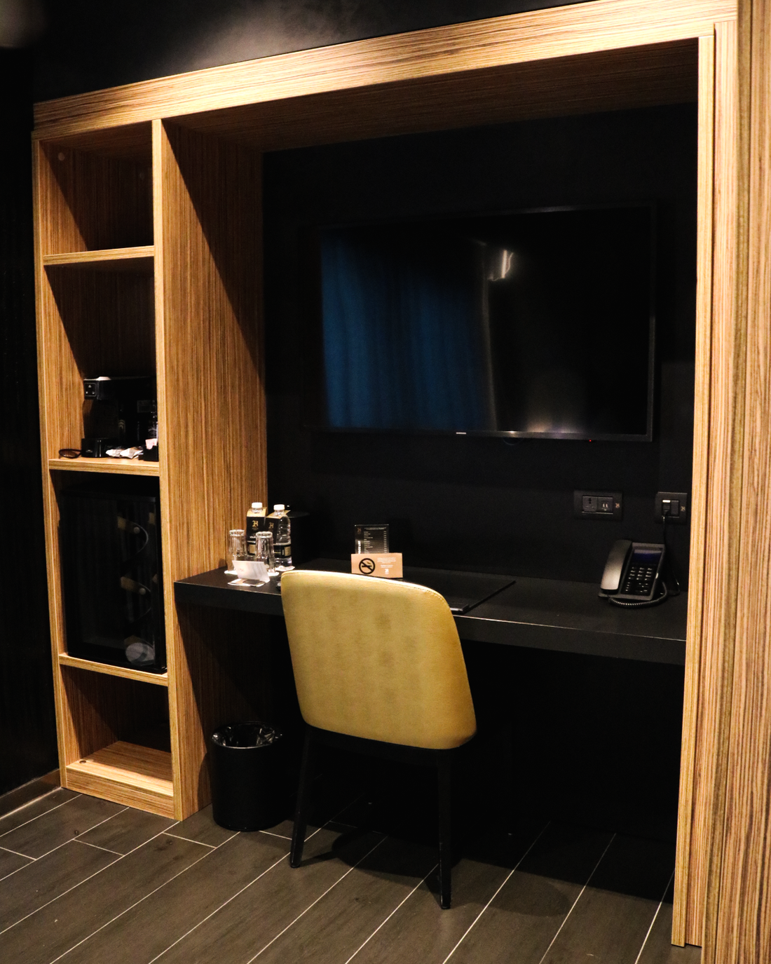 The desk, TV, and minibar.