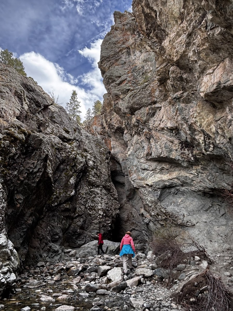 The last section of Zapata Falls trail. The waterfall is behind a narrow bend (the pitch dark triangle in the center of the photo)