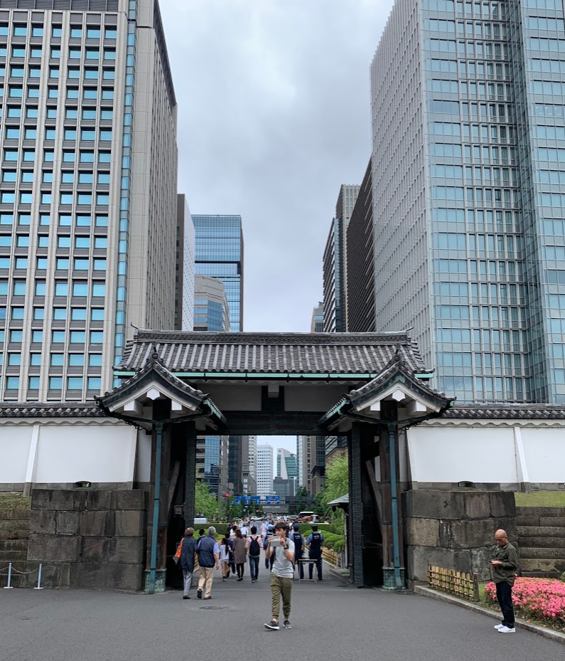 Imperial Gardens gate, Tokyo financial district behind it