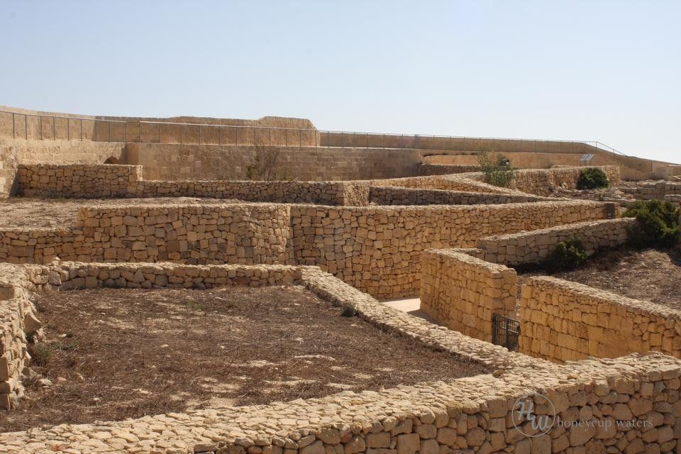 restored walls where buildings would have stood.jpg