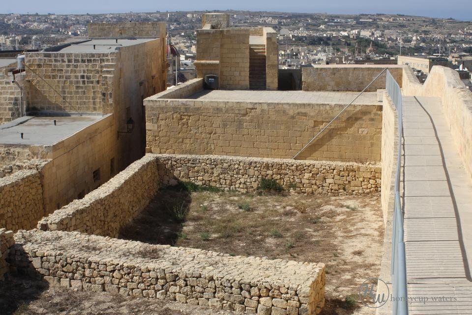 north battlements, restored building walls and pathway to square.jpg