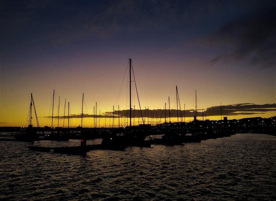 Golden Hour: charming sunset over harbor in Ponta Delgada